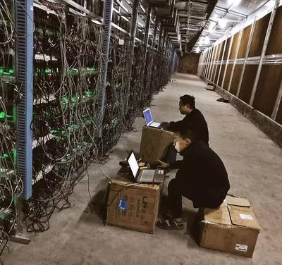 Vast mining farm with rows of ASIC miners